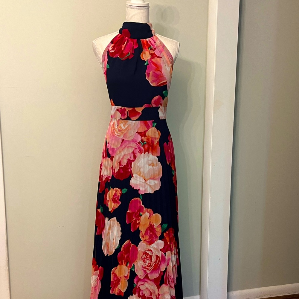 Stunning flowered chiffon lined halter style gown with built in bra!